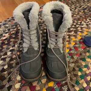 Grey winter boots lace up with fur